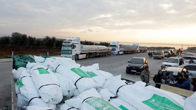 Aid trucks at the border crossing of al-Hamam in Afrin