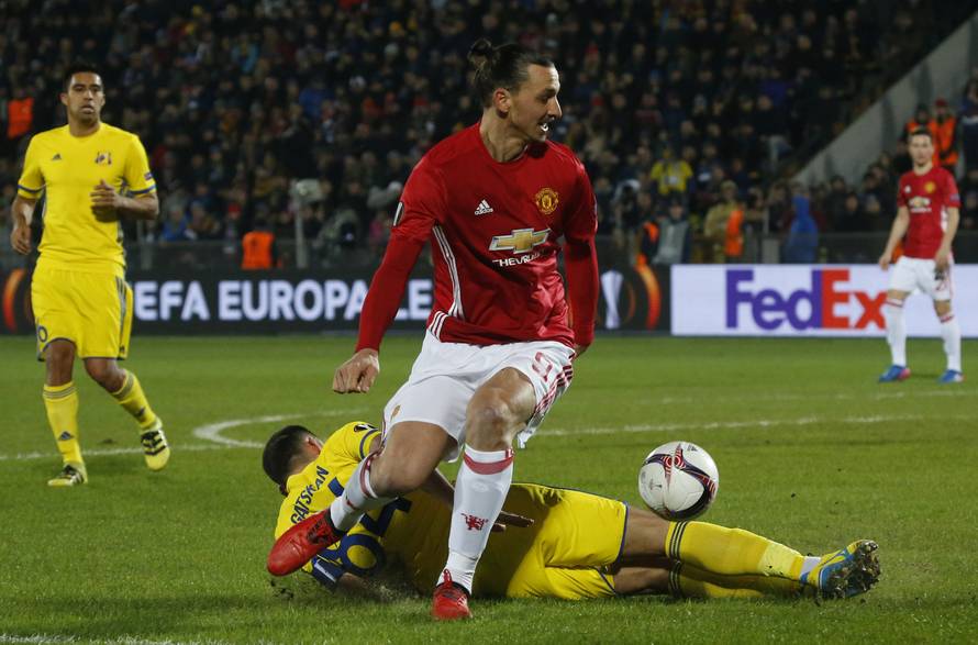 FC Rostov's Aleksandru Gatcan in action with Manchester United's Zlatan Ibrahimovic