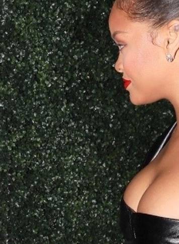Rihanna wears a revealing little black dress to Jay-Z's show at The Forum