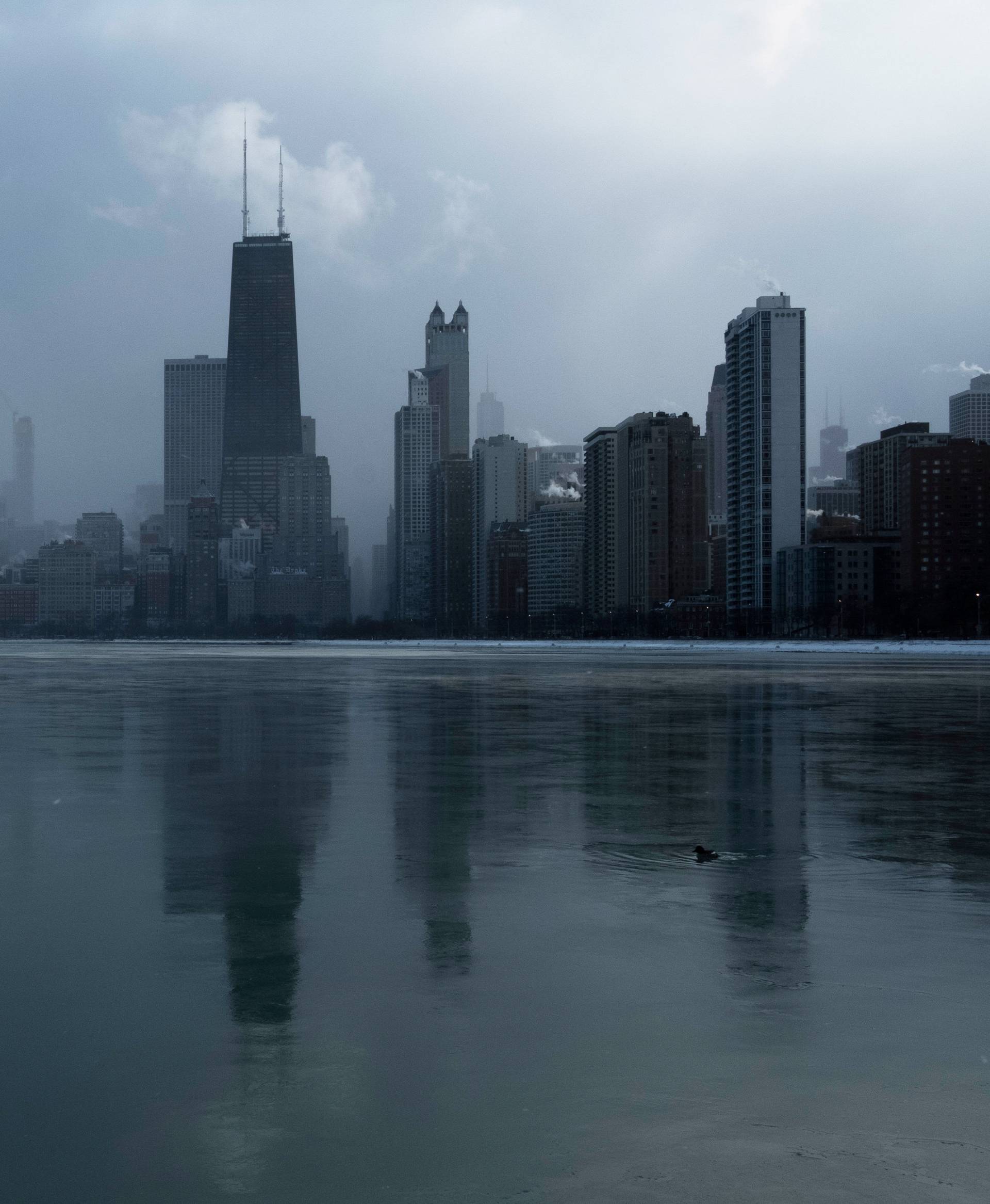 The fog begins to cover the city skyline as bitter cold phenomenon called the polar vortex has descended on much of the central and eastern United States