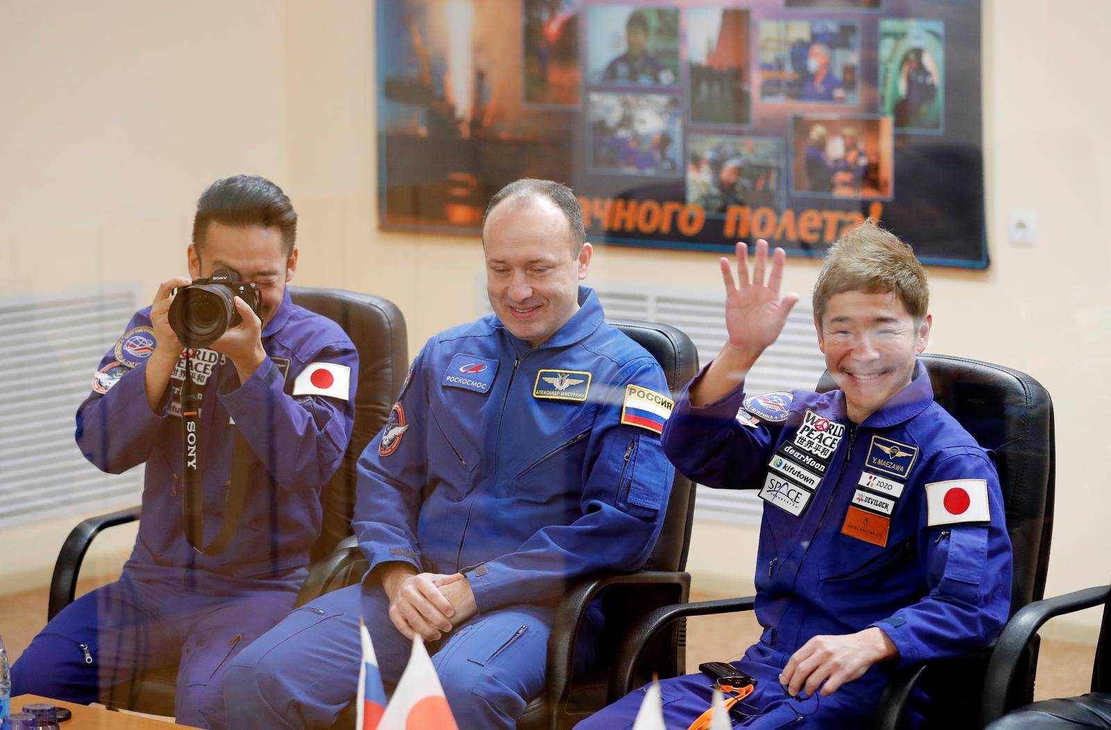 Space flight participants pose for a picture following a meeting of the State Commission in Baikonur