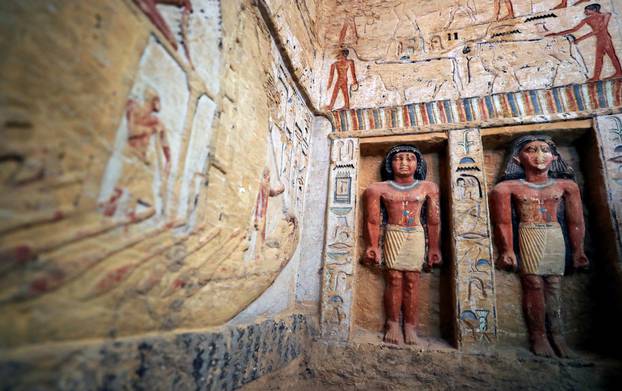 Statues are seen inside the newly-discovered tomb of 