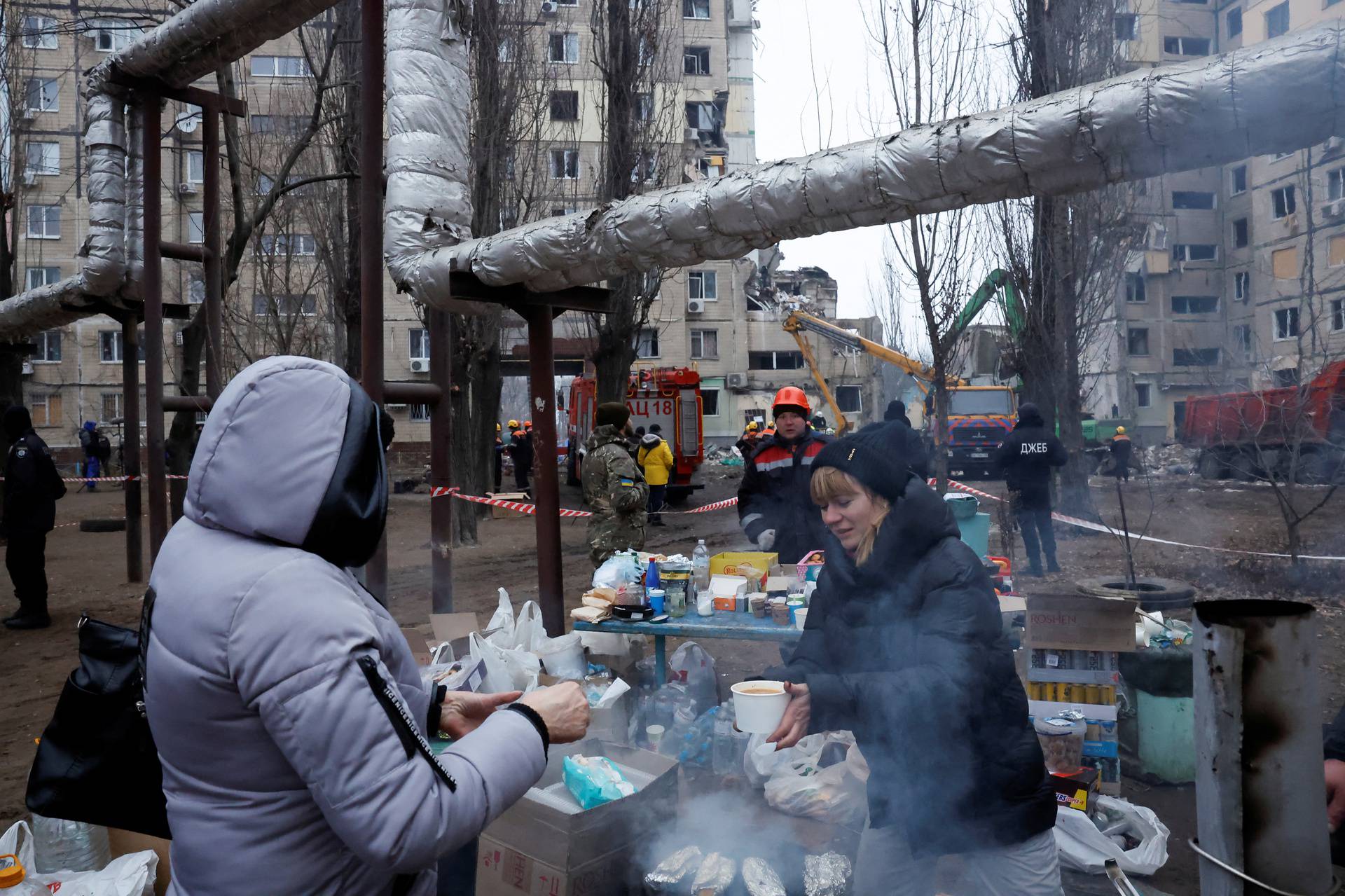 Aftermath of Dnipro apartment block destruction following missile strike