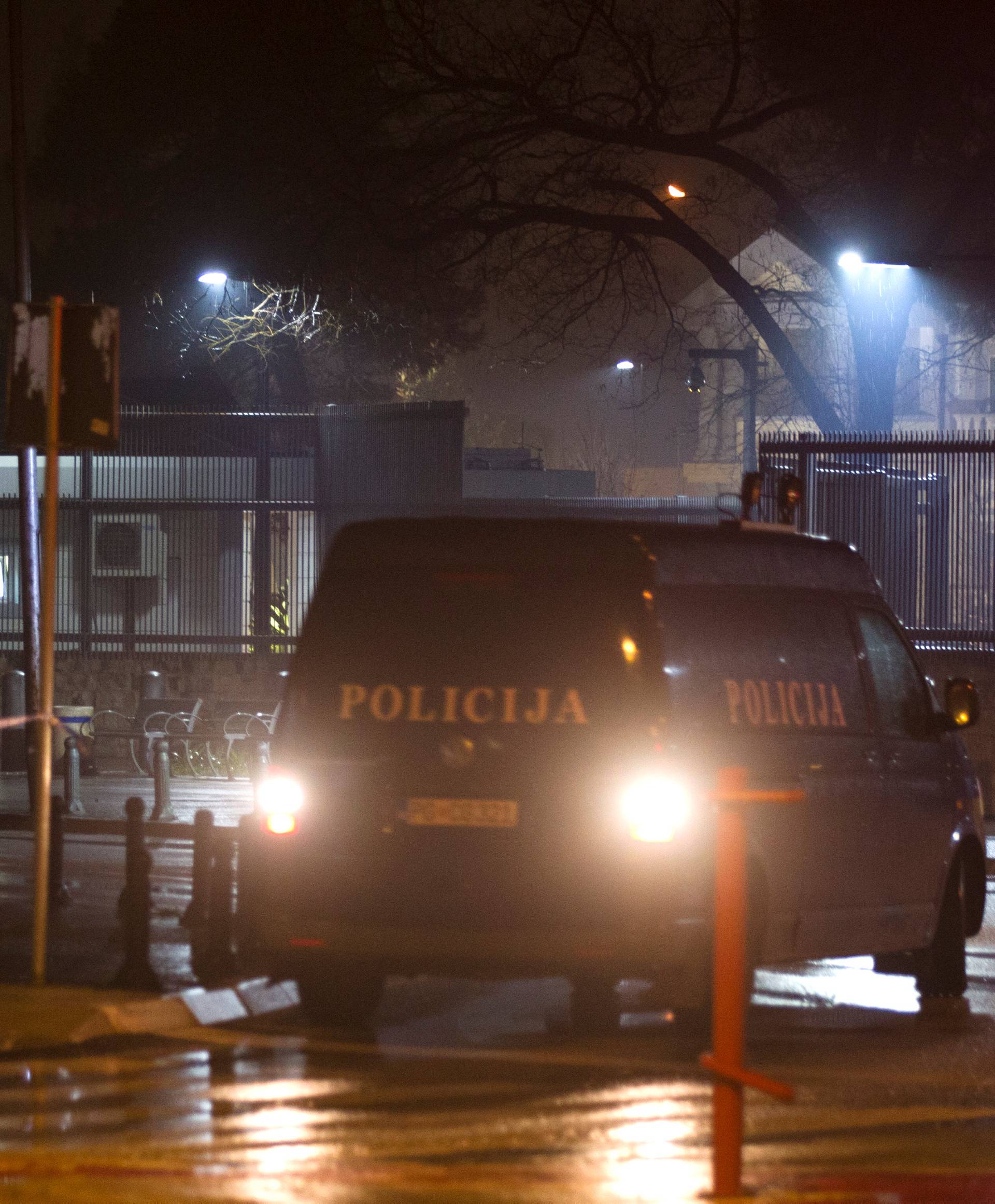 Police guard the entrance to the United States embassy in Podgorica