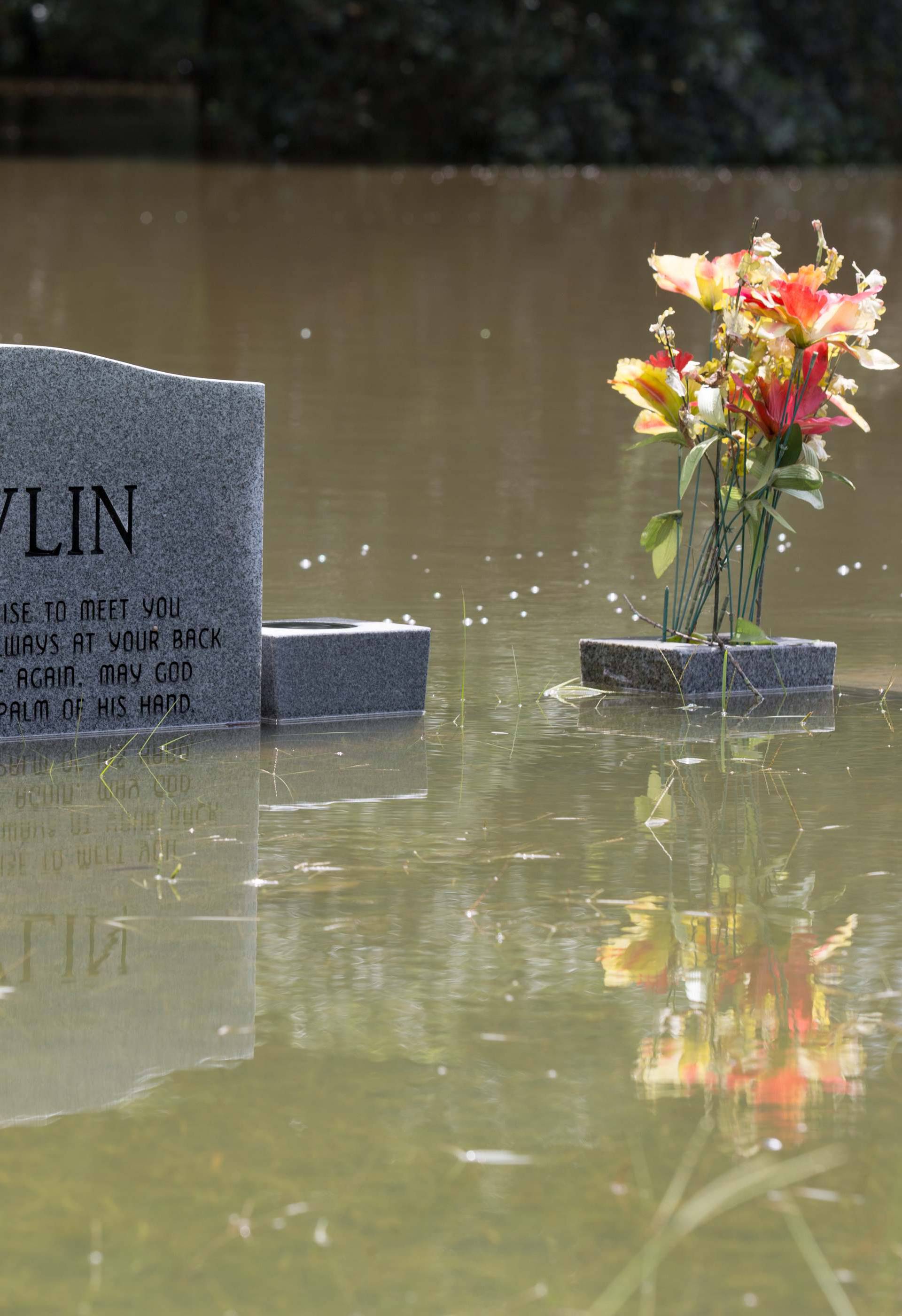 The floodwaters recede from Bethel United Methodist Cemetery in Greenwell Springs