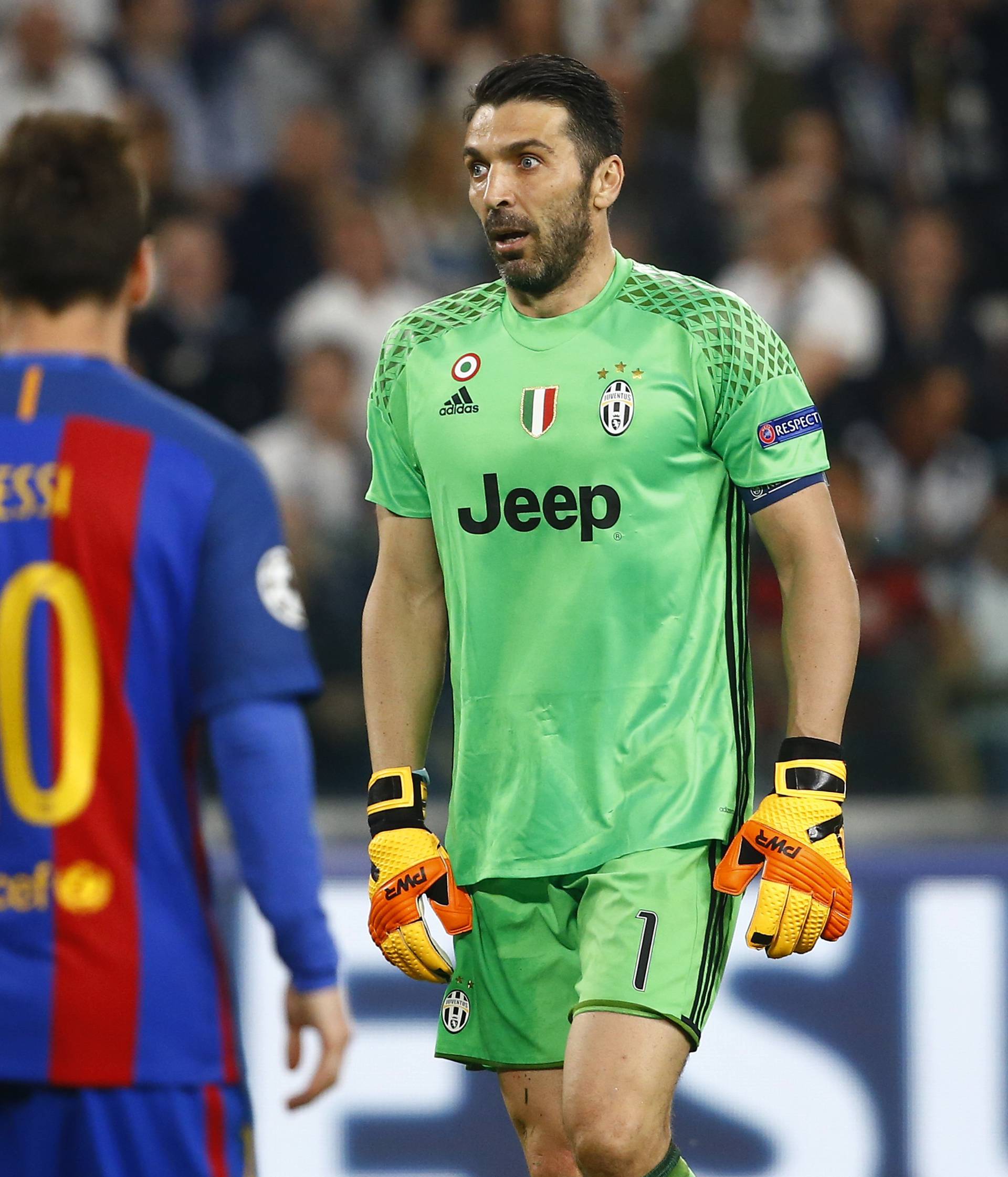 Juventus' Gianluigi Buffon looks on after Barcelona's Lionel Messi has a goal disallowed