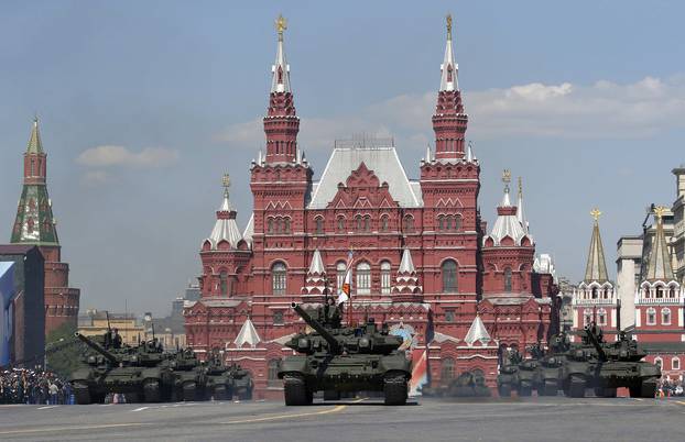 Russian servicemen stand atop T-90A main battle tanks during the Victory Day parade, marking the 71st anniversary of the victory over Nazi Germany in World War Two, at Red Square in Moscow