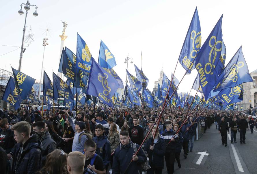 People take part in a procession to mark the Defender of Ukraine Day in Kiev