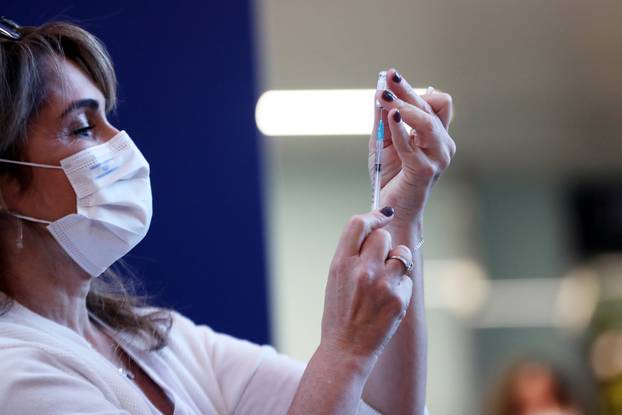 A medical worker prepares a coronavirus disease (COVID-19) vaccine as Israel kicks off a coronavirus vaccination drive, at Tel Aviv Sourasky Medical Center (Ichilov Hospital) in Tel Aviv