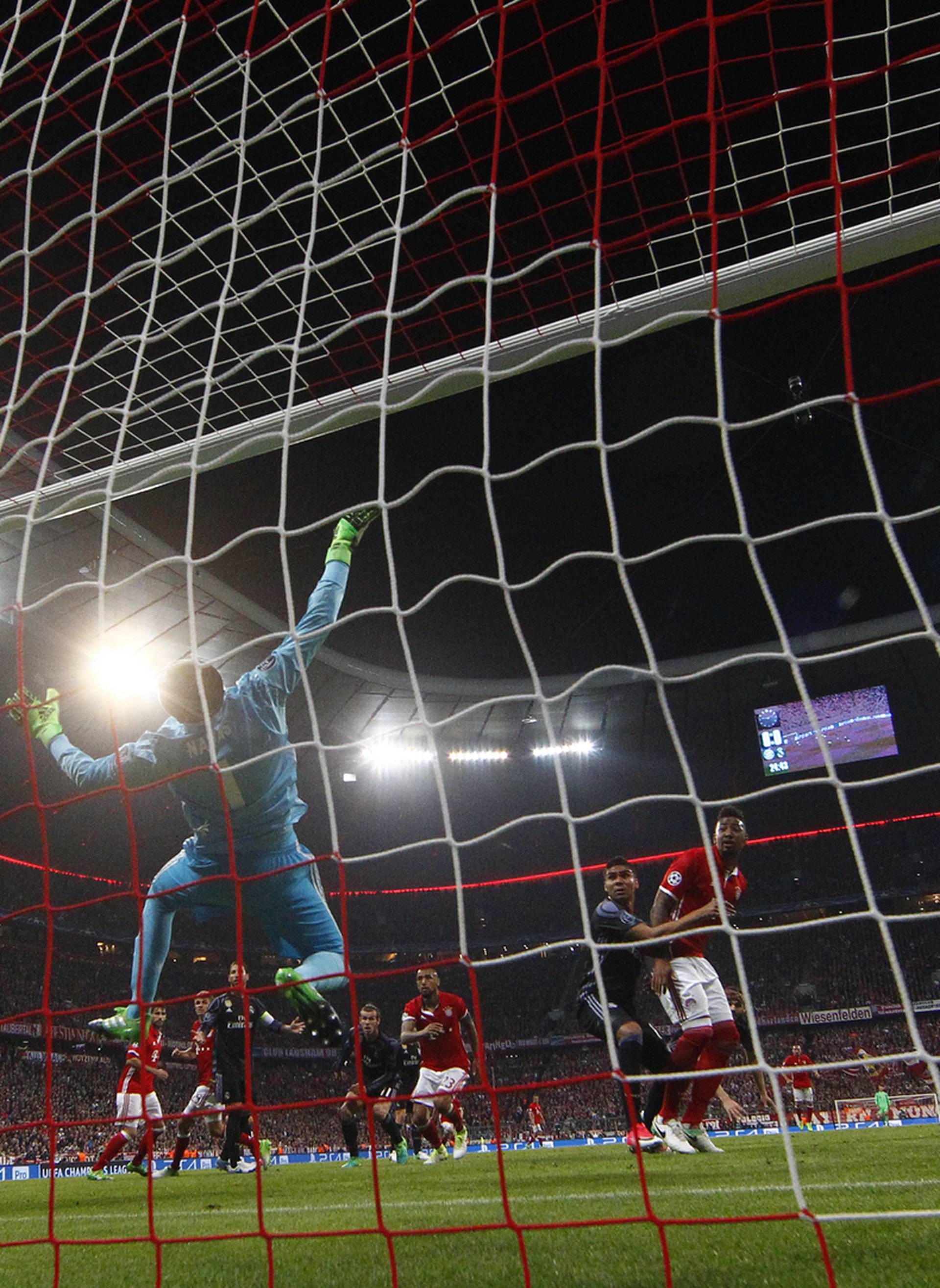 Bayern Munich's Arturo Vidal scores their first goal past Real Madrid's Keylor Navas