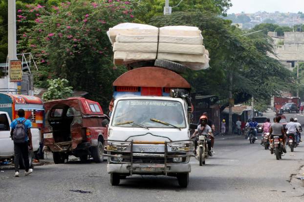 Haitians flee homes due to gang violence, in Port-au-Prince