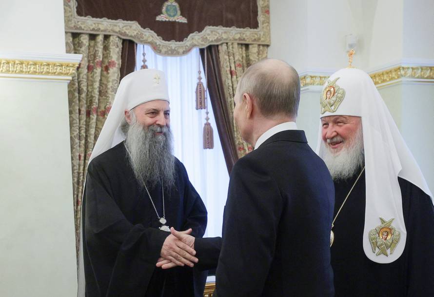 Russian President Vladimir Putin welcomes Serbian Patriarch Porfirije in Moscow