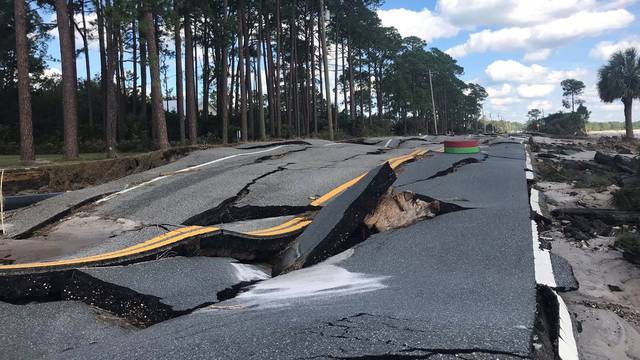 A damaged road after Hurricane Michael blew through Carrabelle, Florida