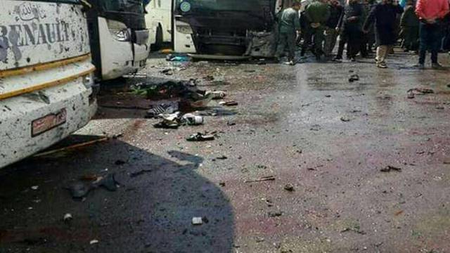 Blood stains the ground at the site of an attack by two suicide bombers in Damascus