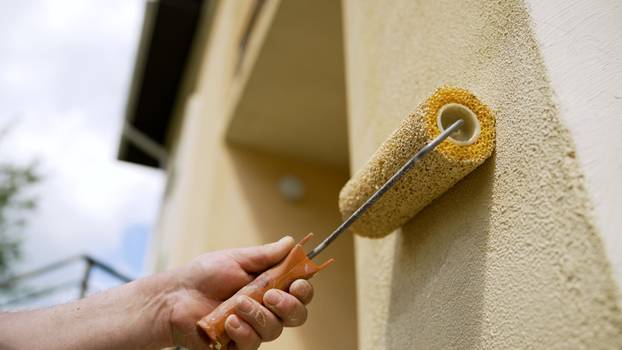A,Maintenance,Worker,Uses,A,Roller,Brush,To,Paint,A