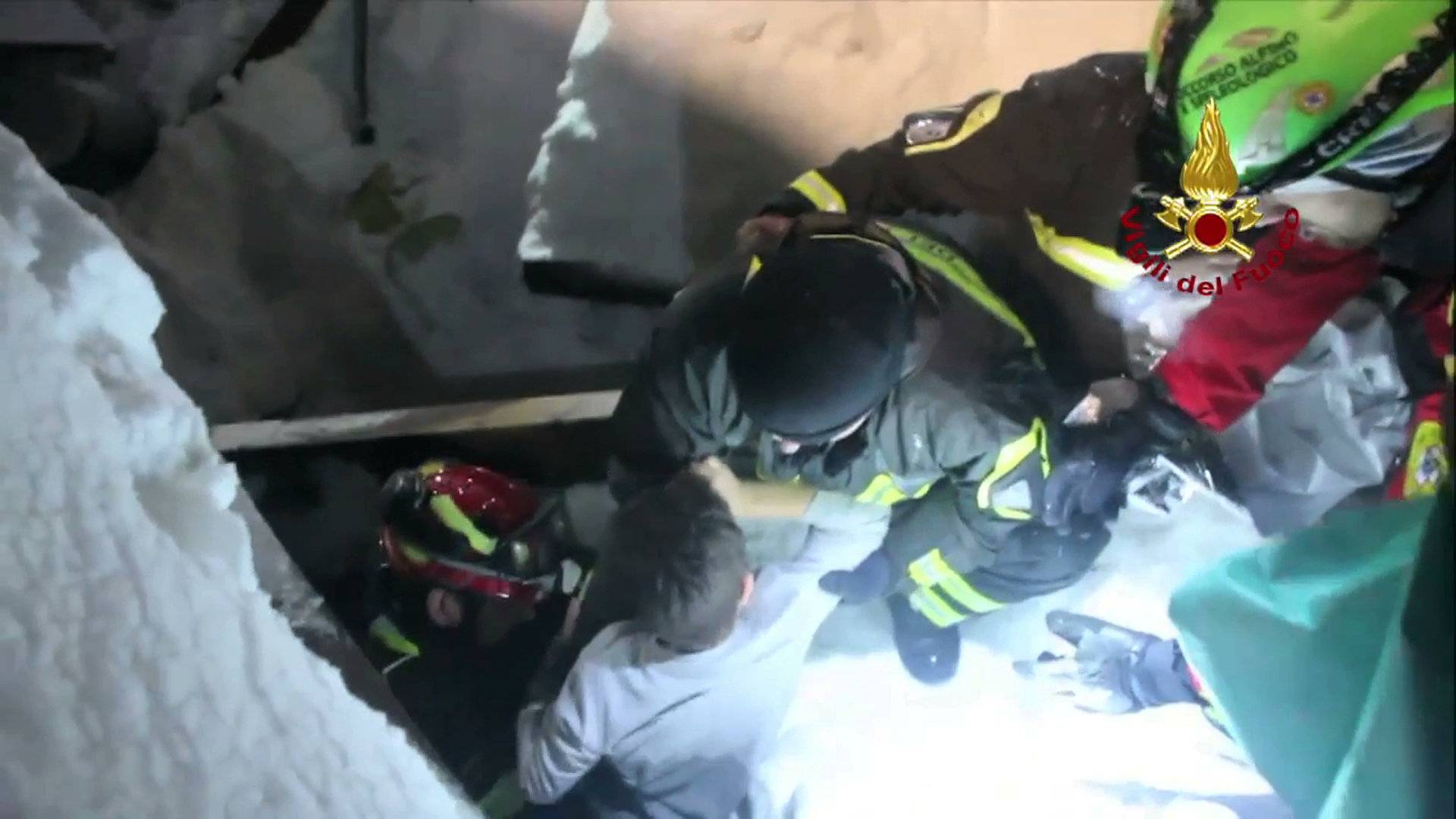 A still image taken from a video shows a survivor, rescued by Italian Firefighters, at the Hotel Rigopiano in Farindola, central Italy, which was hit by an avalanche