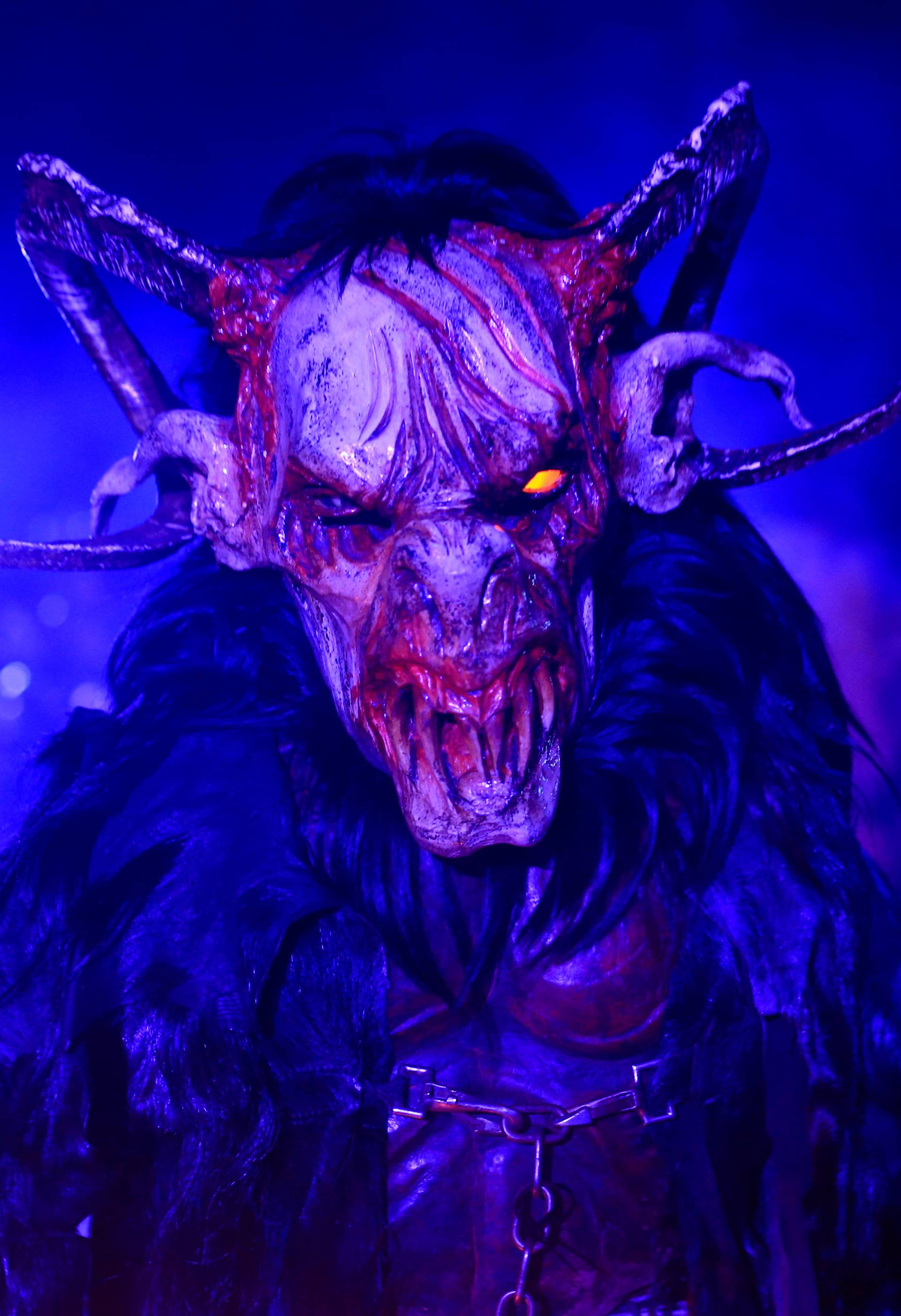 A man dressed as a demon performs during a Krampus show in Goricane