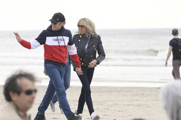 Emmanuel Macron and wife Brigitte  walking on the beach -  Le Touquet