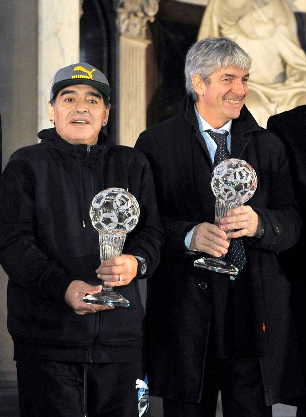 Diego Maradona and Paolo Rossi pose for a photo as they attend the Italian football hall of fame awards ceremony