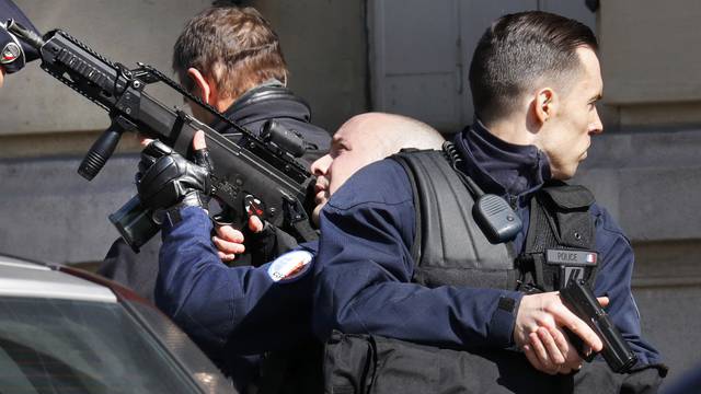 Police outside the International Monetary Fund offices where an envelope exploded in Paris