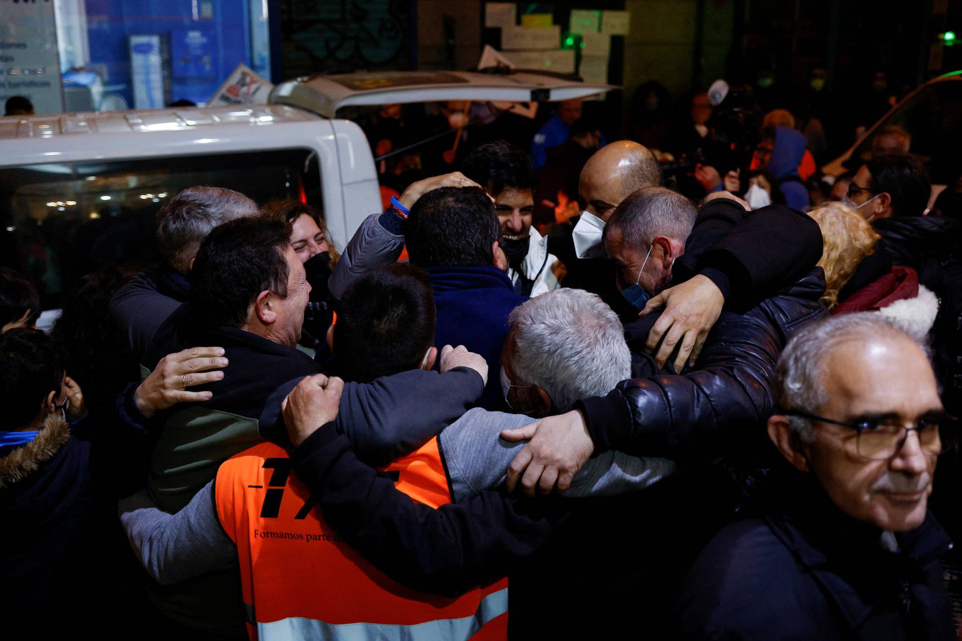Taxi drivers celebrate arriving from Poland with families fleeing Russia's invasion of Ukraine in Madrid