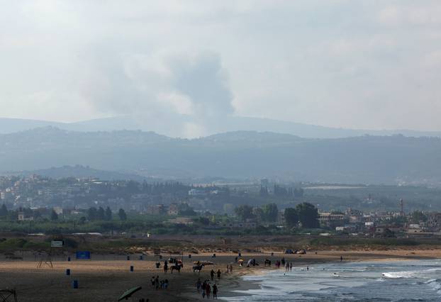 A view shows smoke on the Lebanese side of the border with Israel, as seen from Tyre