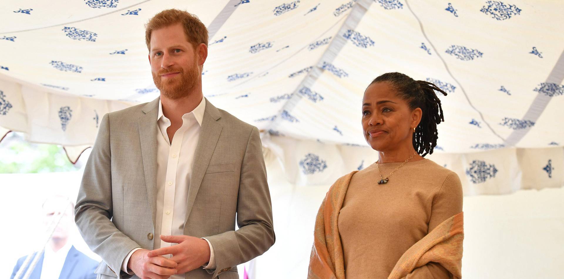 Britain's Prince Harry, and Doria Ragland listen to Meghan, Duchess of Sussex speaking at the launch of a cookbook with recipes from a group of women affected by the Grenfell Tower fire at Kensington Palace in London