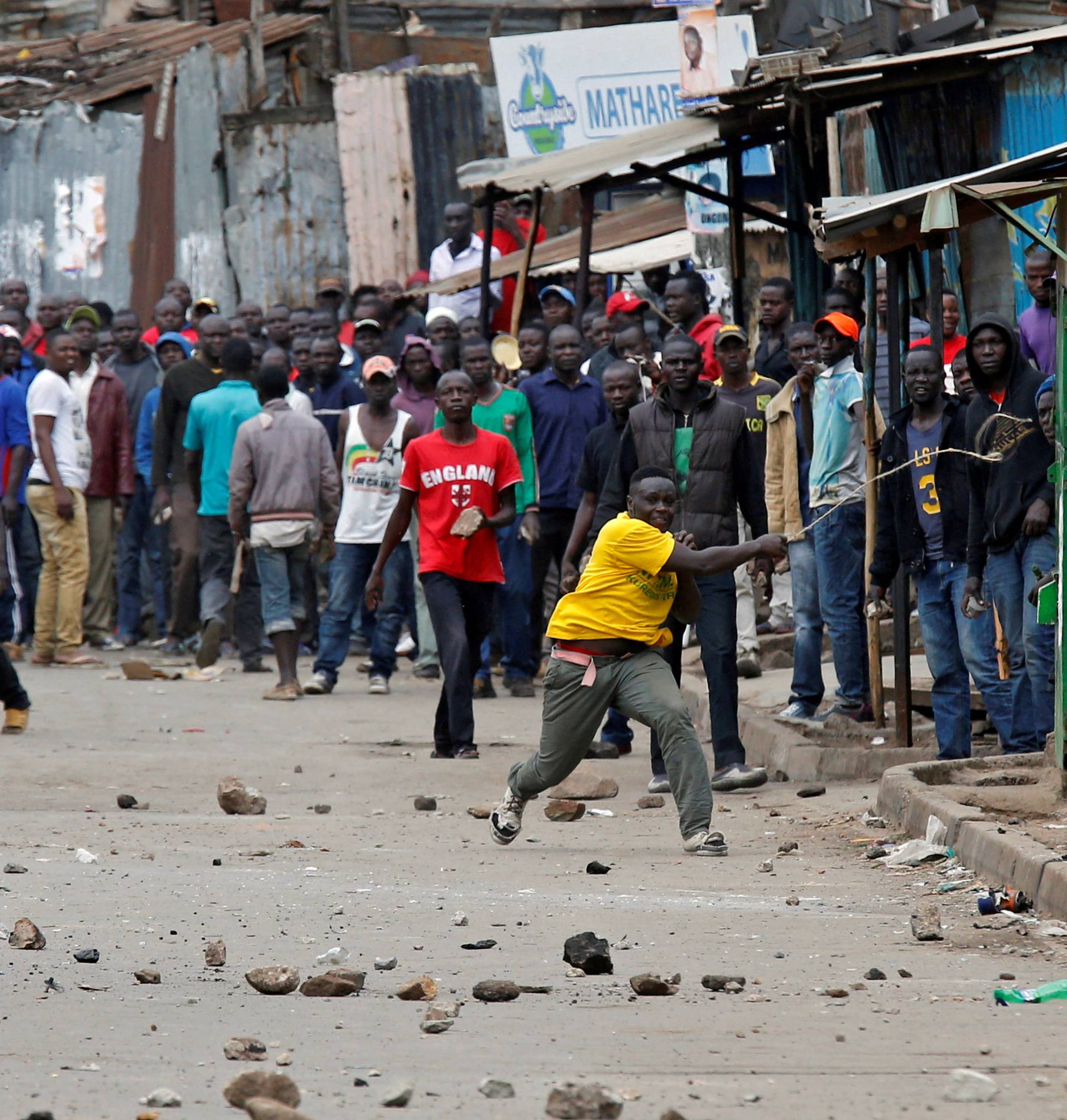 Demonstrators, supporting opposition leader Raila Odinga, throw stones in Mathare, in Nairobi
