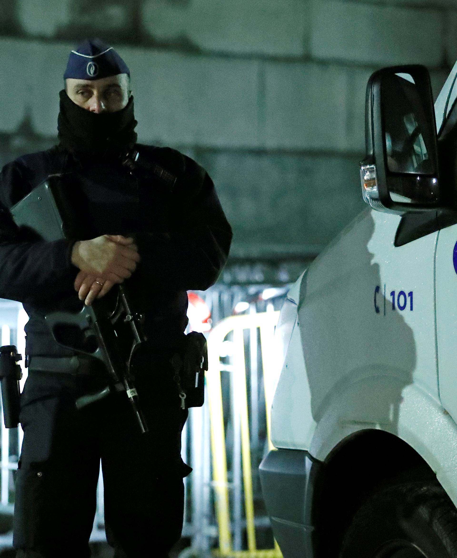 A Belgian police officer keeps guard at the entrance of the courthouse ahead of the trial of Salah Abdeslam, one of the suspects in the 2015 Islamic State attacks in Paris, in Brussels