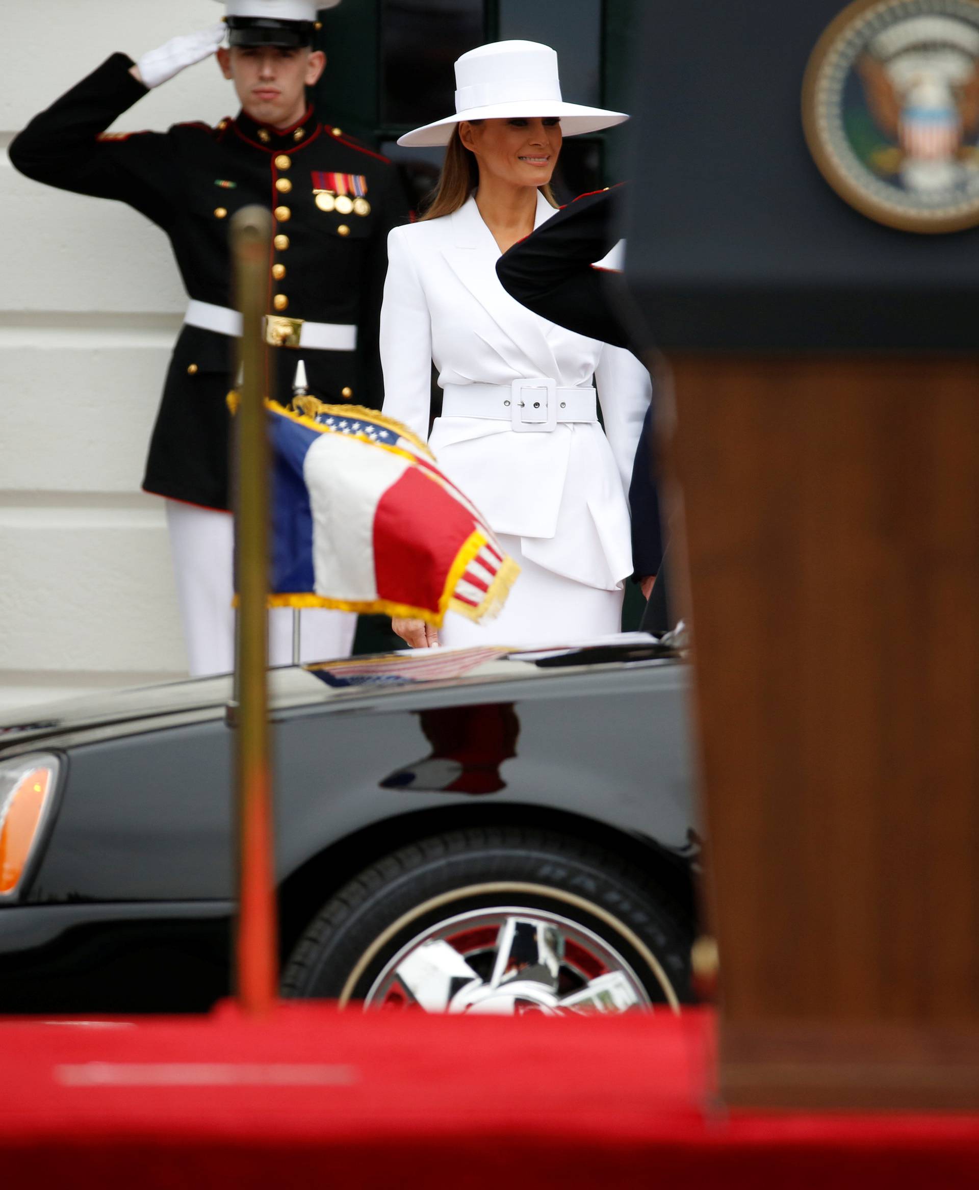 U.S. President Donald Trump and first lady Melania Trump welcome French President Emmanuel Macron and his wife Brigitte Macron during an arrival ceremony at the White House in Washington