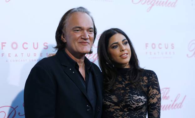 Director Tarantino and Daniela Pick pose at a premiere for "The Beguiled" in LA