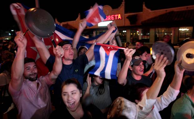 People celebrate after the announcement of the death of Cuban revolutionary leader Fidel Castro in the Little Havana district of Miami