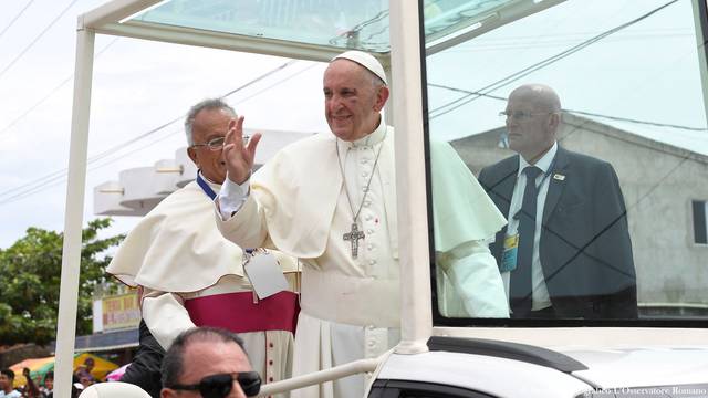 Pope Francis greets faithful from his popemobile in Cartagena