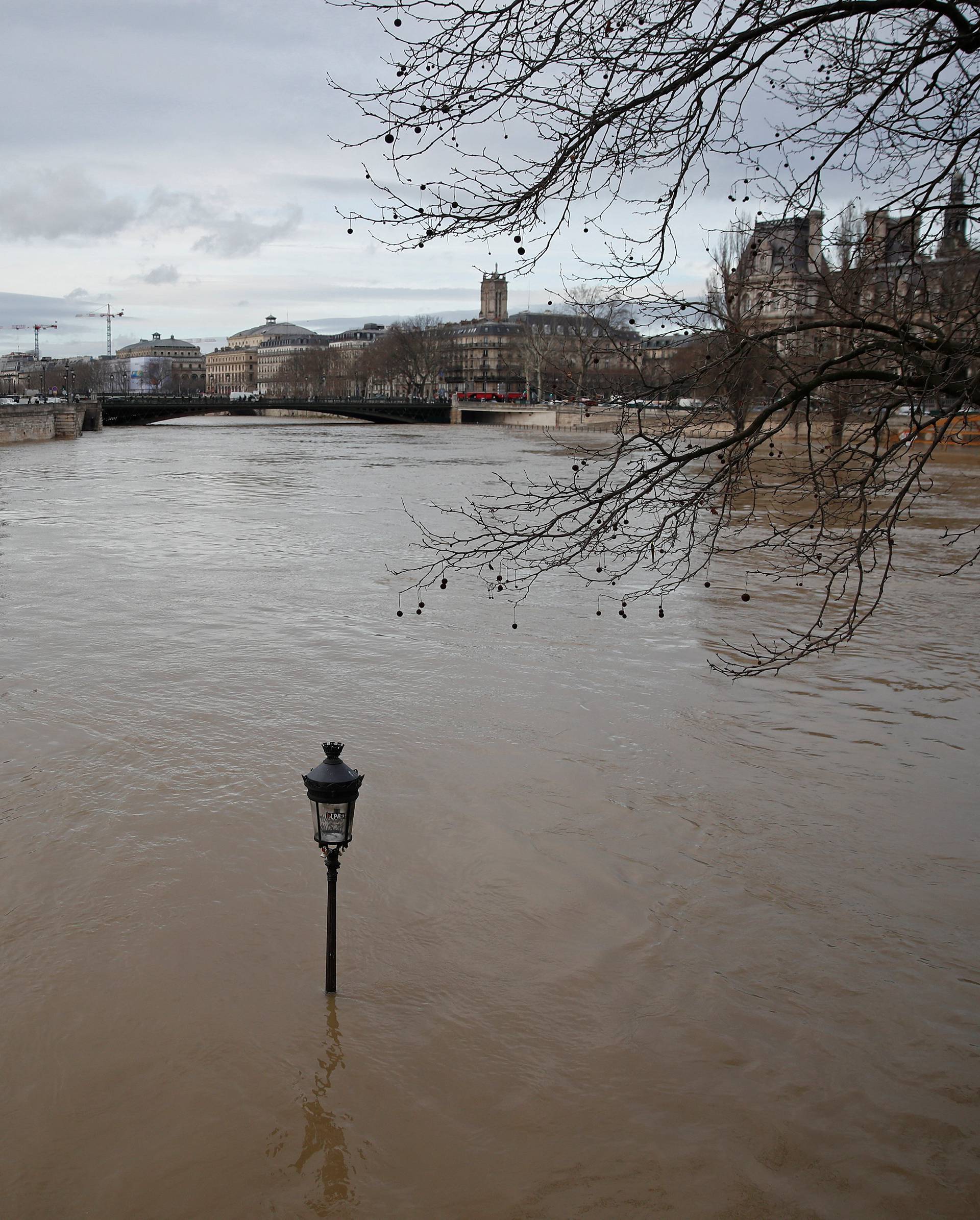 A street-lamp is seen on the flooded banks of the Seine River in Paris