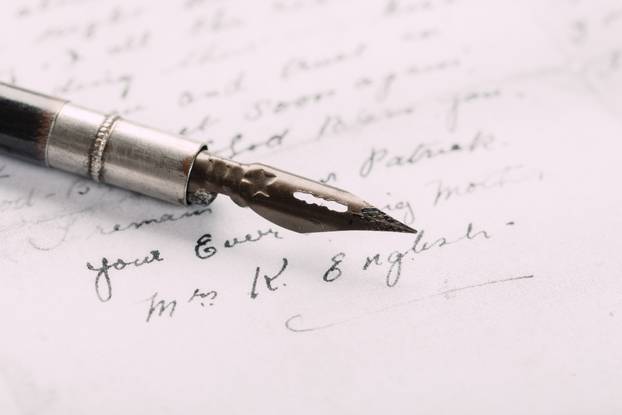 fountain pen on paper with ink text closeup