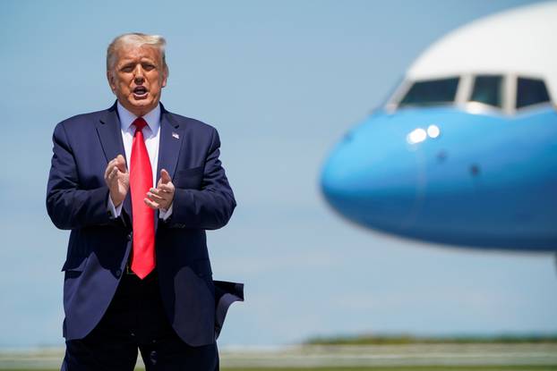 U.S. President Donald Trump greets supporters as he arrives in Cleveland, Ohio