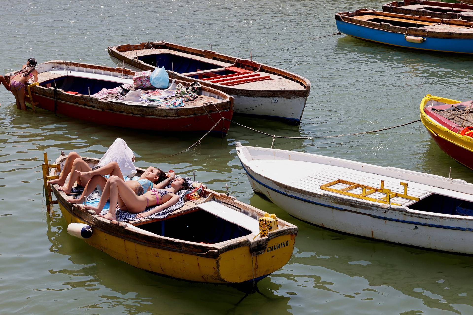 Neapolitans cope with African heat wave as temperatures approach 40 degrees Celsius, in Naples