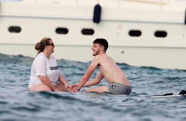 England footballer Declan Rice pictured on a luxury yacht with his girlfriend Lauren Fryer as they enjoy their holidays in Formentera!