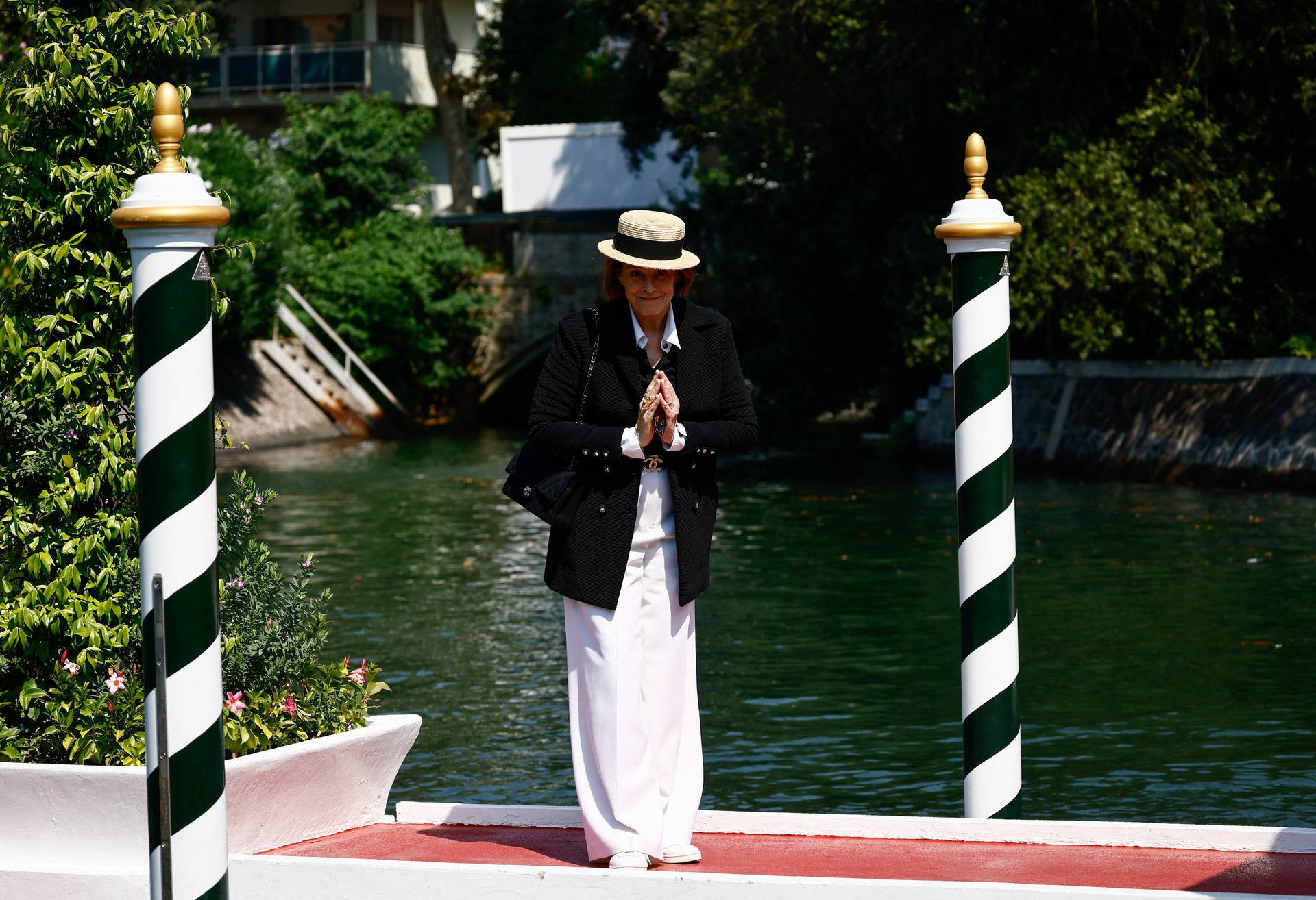 Attendees arrive for the 81st Venice International Film Festival, in Venice