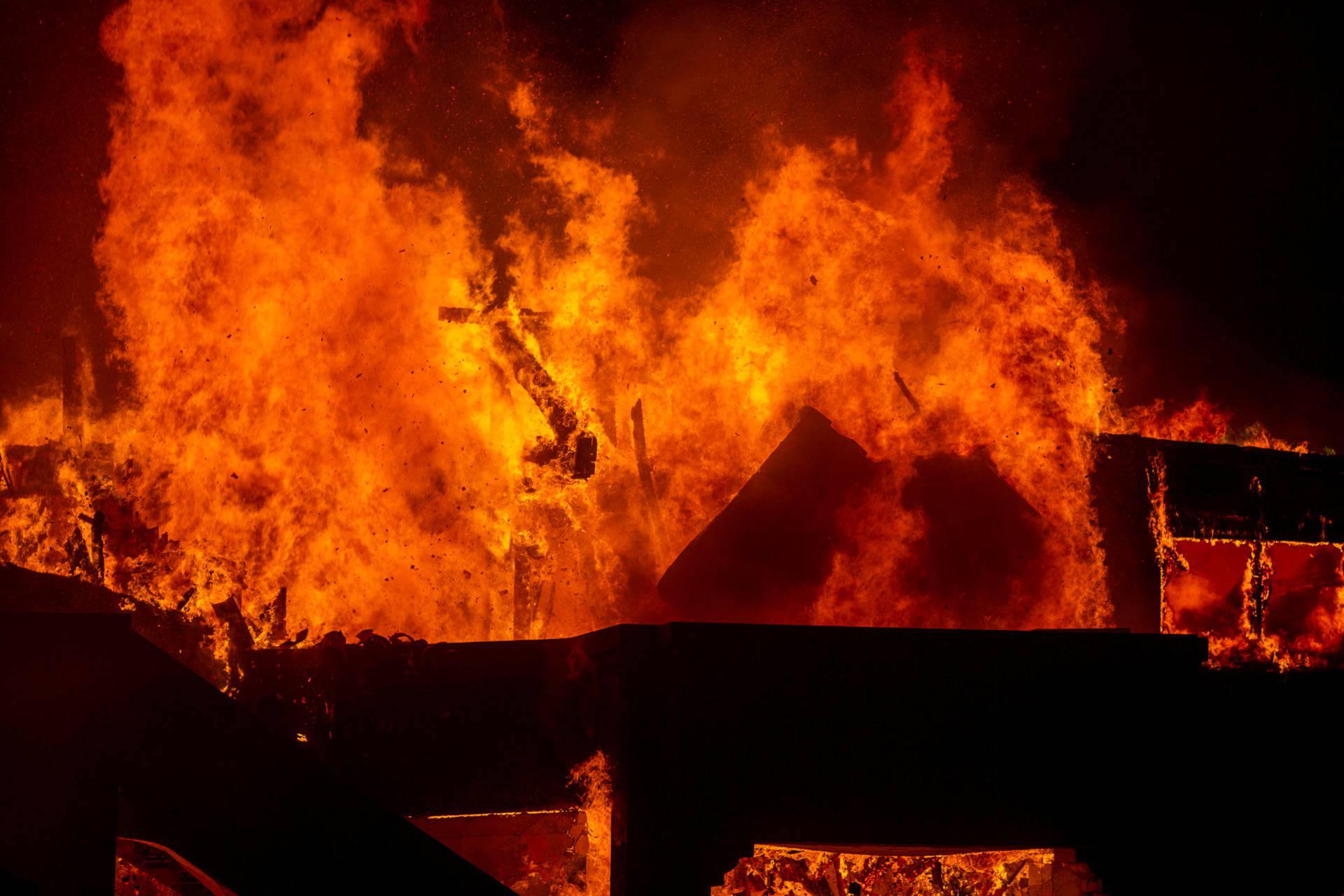 Palisades fire burns during a windstorm on the west side of Los Angeles