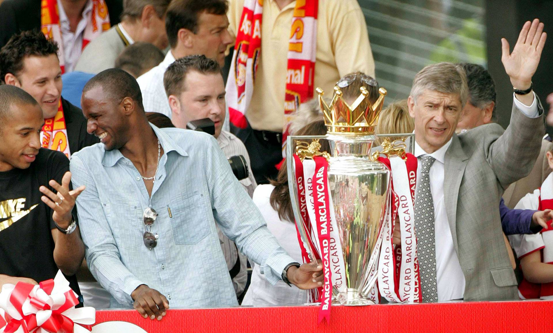 FILE PHOTO: Arsenal's Thierry Henry, Patrick Viera and manager Arsene Wenger celebrate during a victory parade