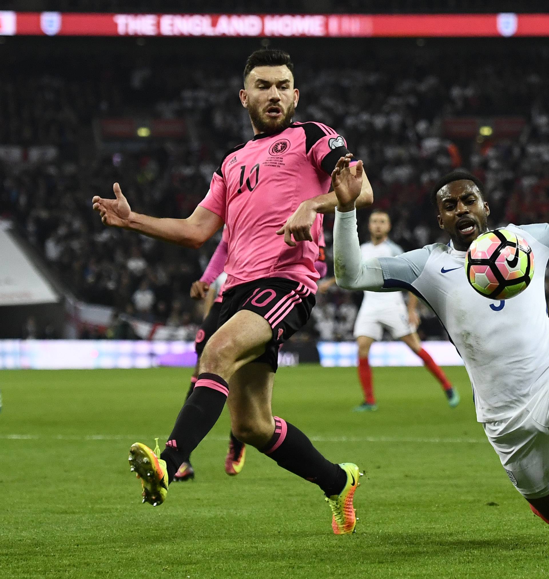 England's Danny Rose goes down in the box under a challenge from Scotland's Robert Snodgrass