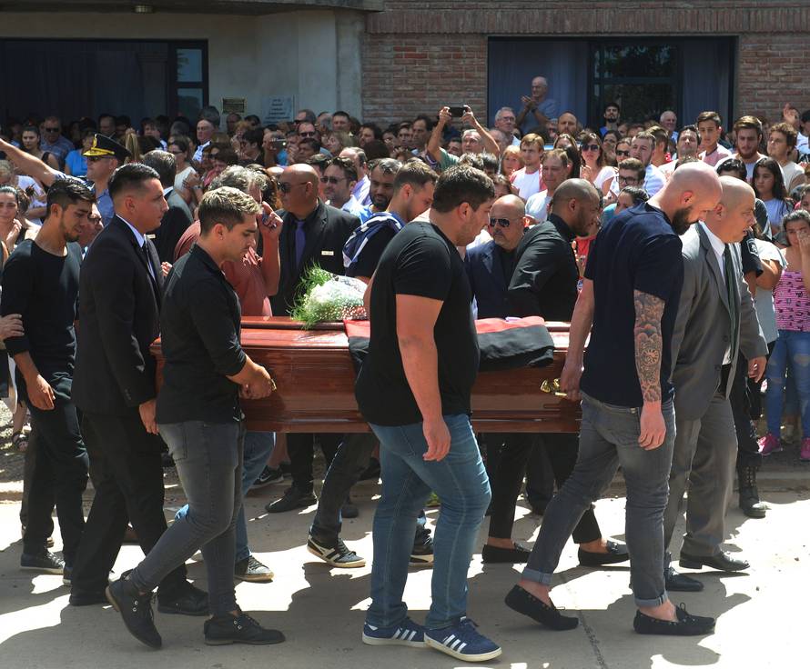 Family and friends carry the coffin of Emiliano Sala, soccer player who died in a plane crash in the English Channel, while a crowd attends his wake in Progreso