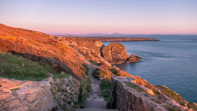 Sunset at the cliffs by the south stack lighthouse on Anglesey in Wales