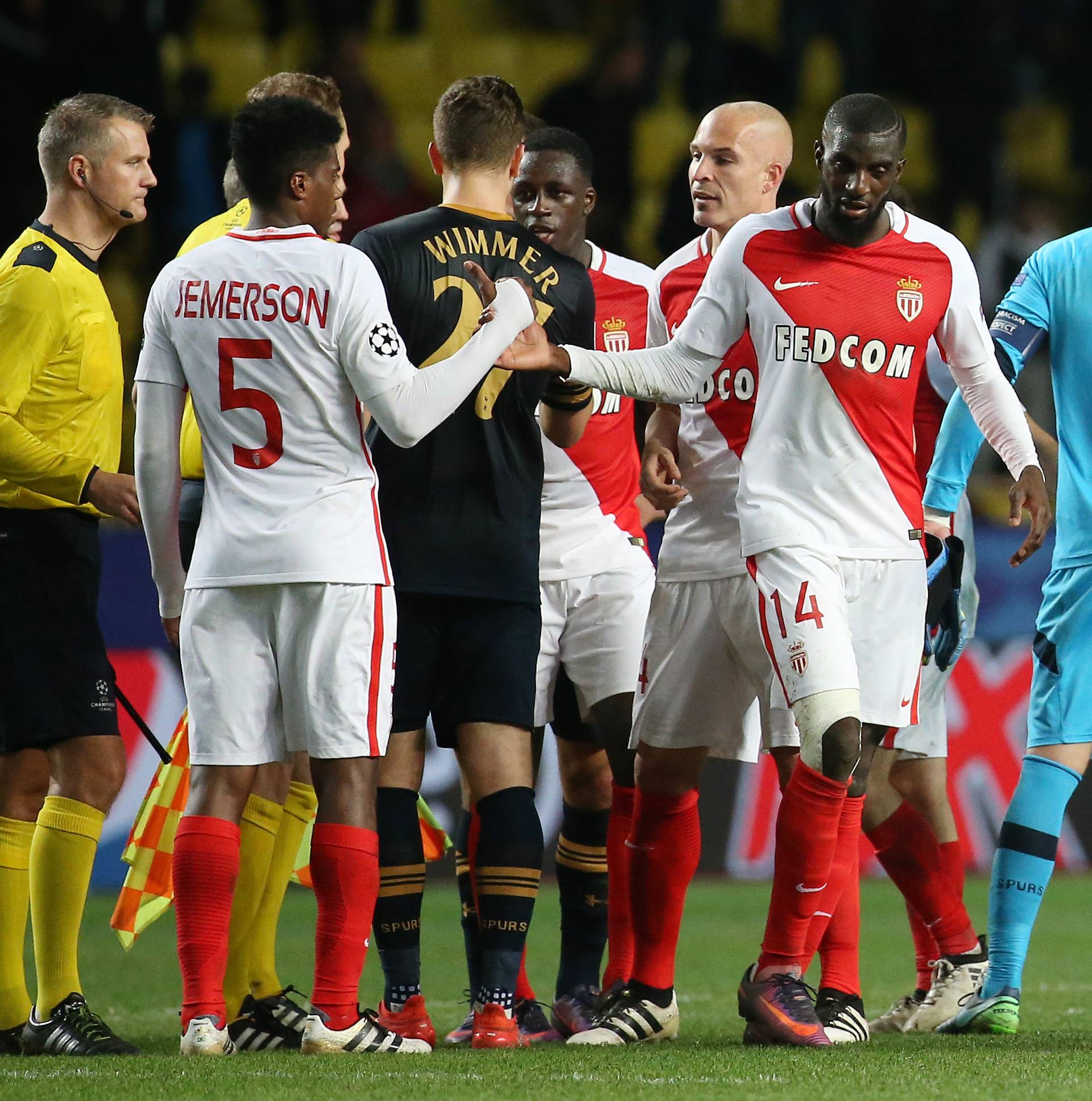 Tottenham's Hugo Lloris (2nd R) and Monaco's Danijel Subasic (R) shake hands at full time