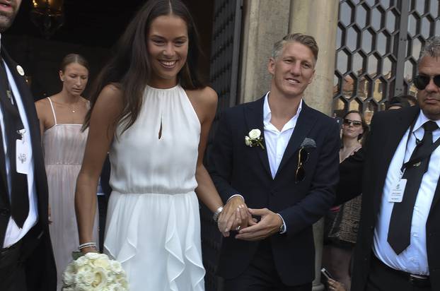 Manchester Utd and Germany National team player Bastian Schweinsteiger ties the know with his fiancee