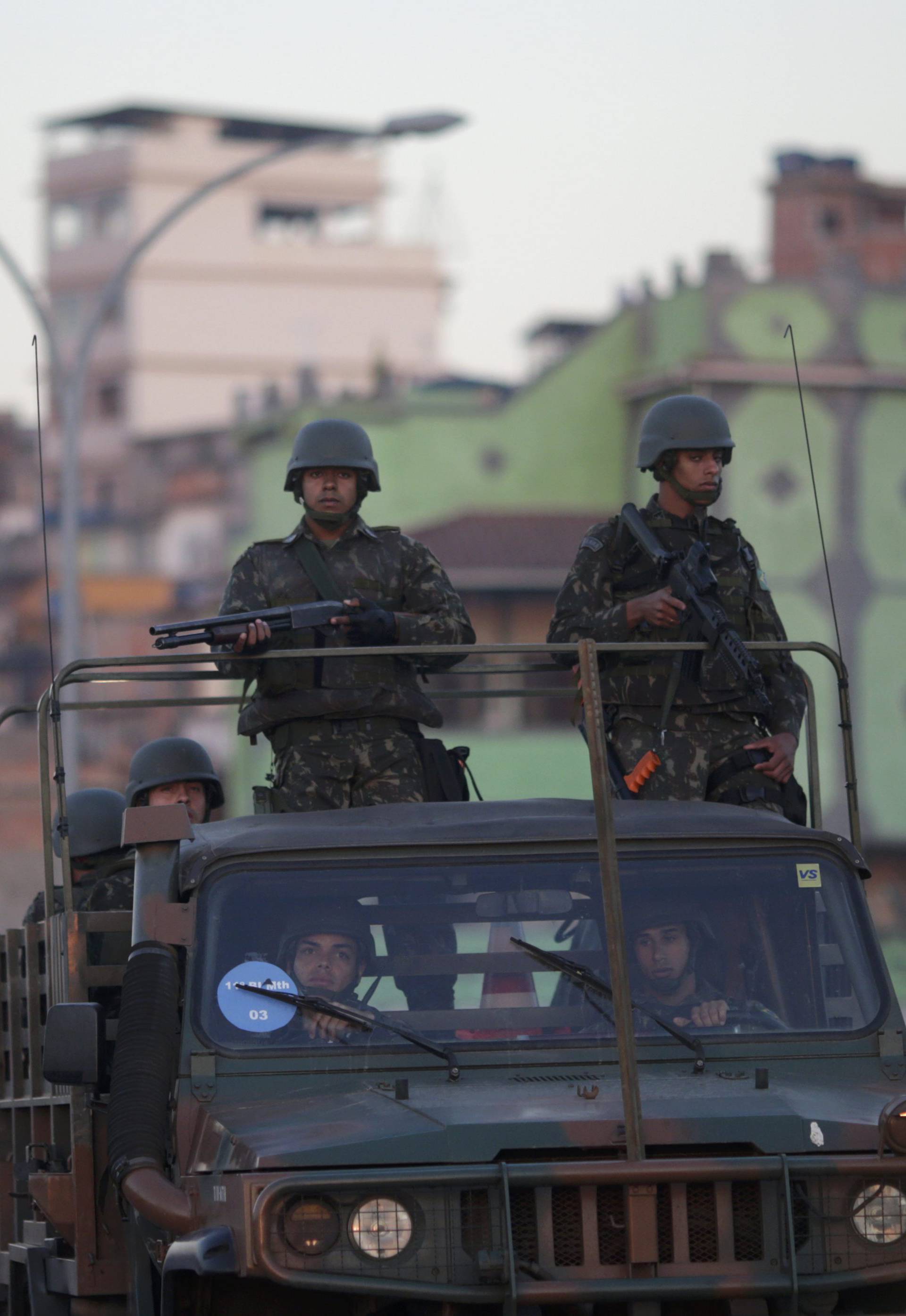 Brazilian soldiers patrol near the Complexo do Mare favela in Rio de Janeiro