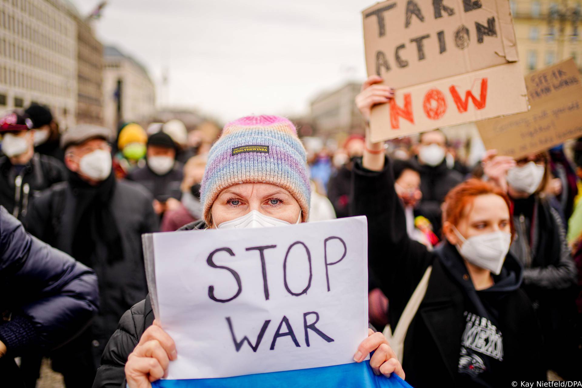 Berlin: Participants in a solidarity demonstration for Ukraine stand in Paris Square with a poster "Cut Swift Cut Russia Off".