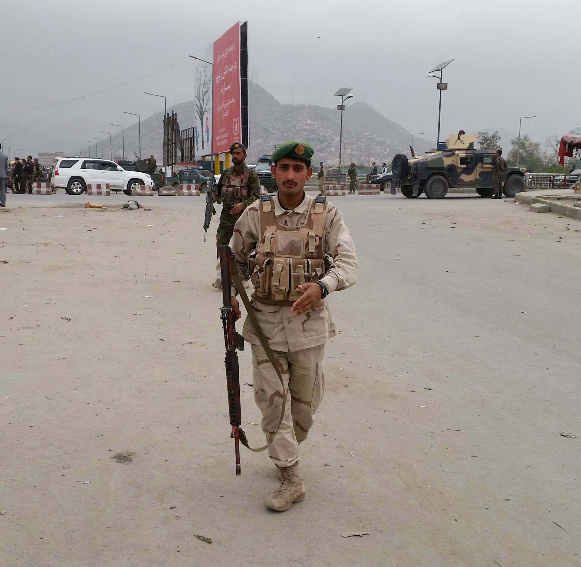 Security forces members keep watch at the site of an explosion in Kabul, Afghanistan 