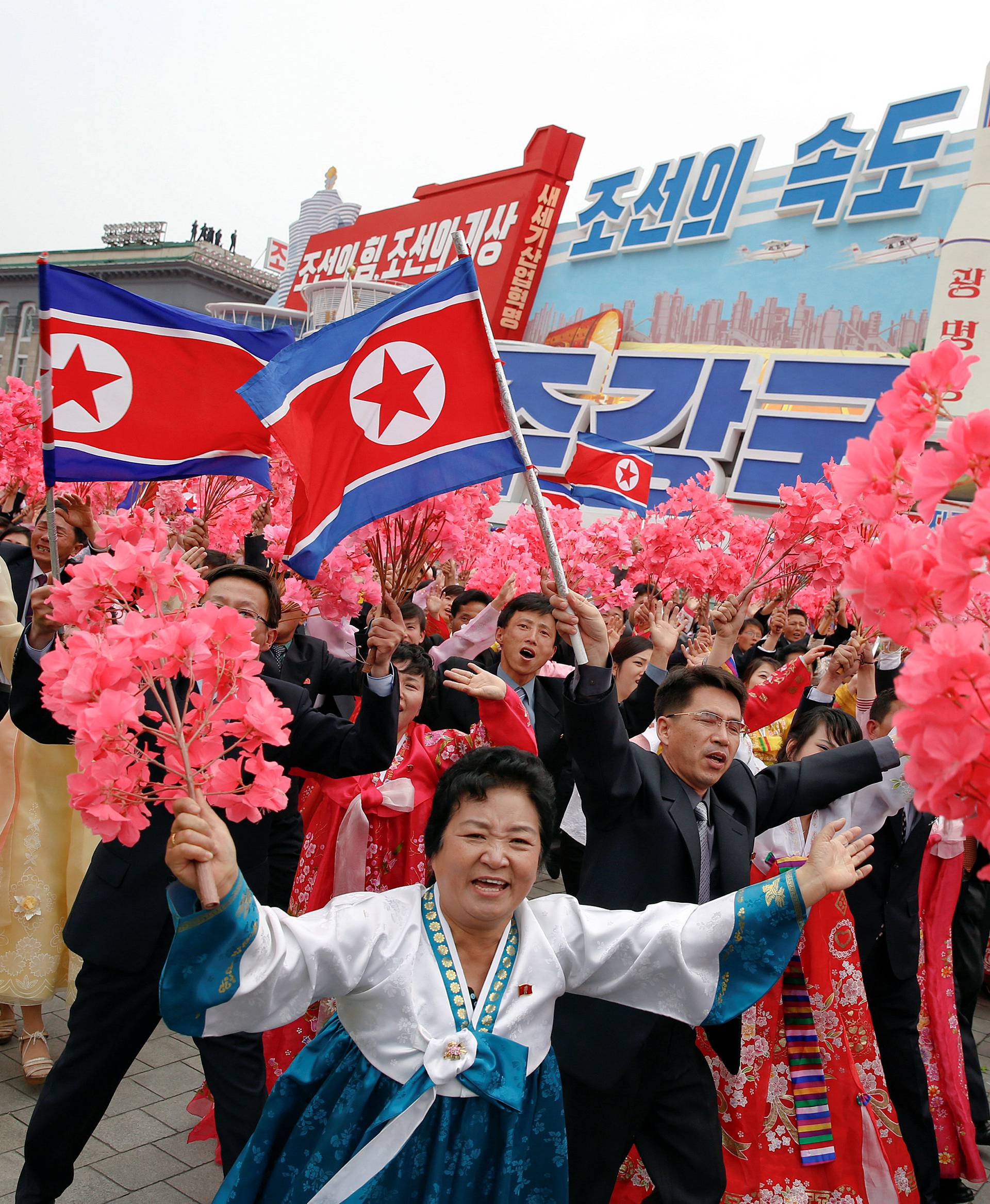 People react as they see North Korean leader Kim Jong Un during a mass rally and parade in Pyongyang